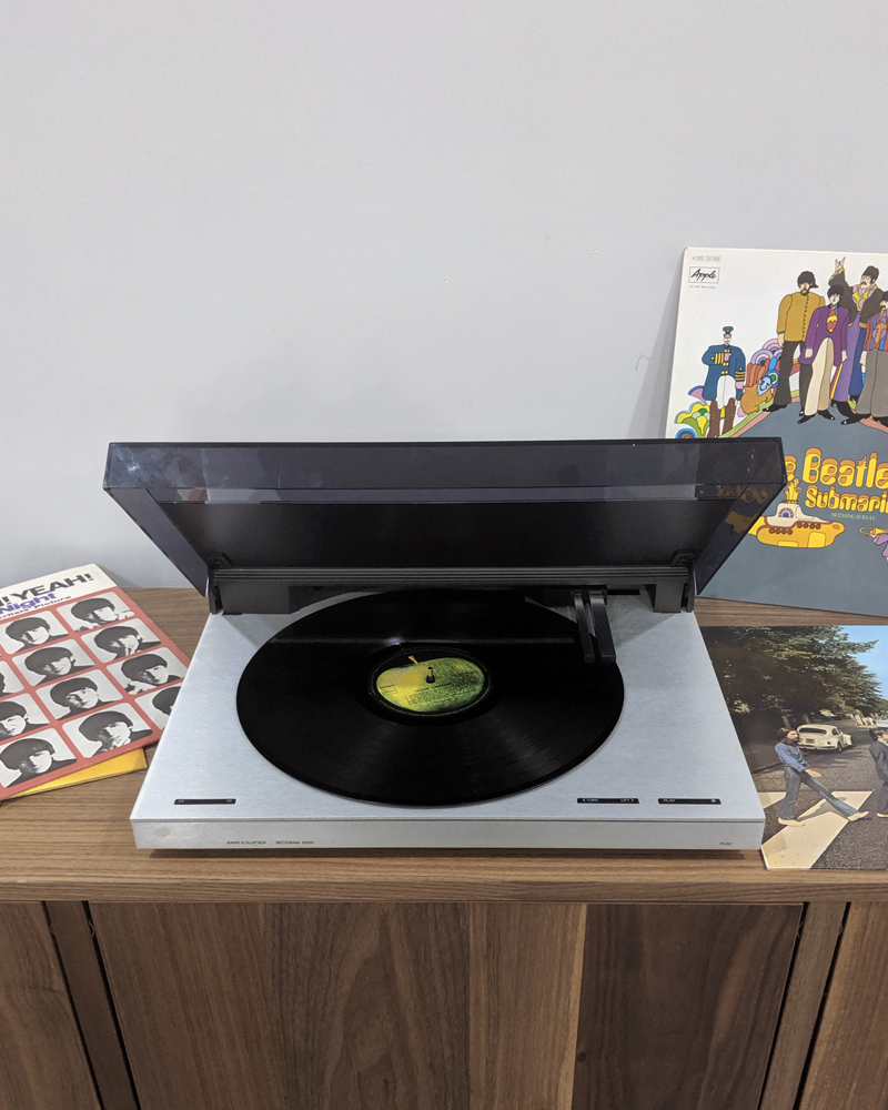 Bang & Olufsen record player with several Beatles albums.